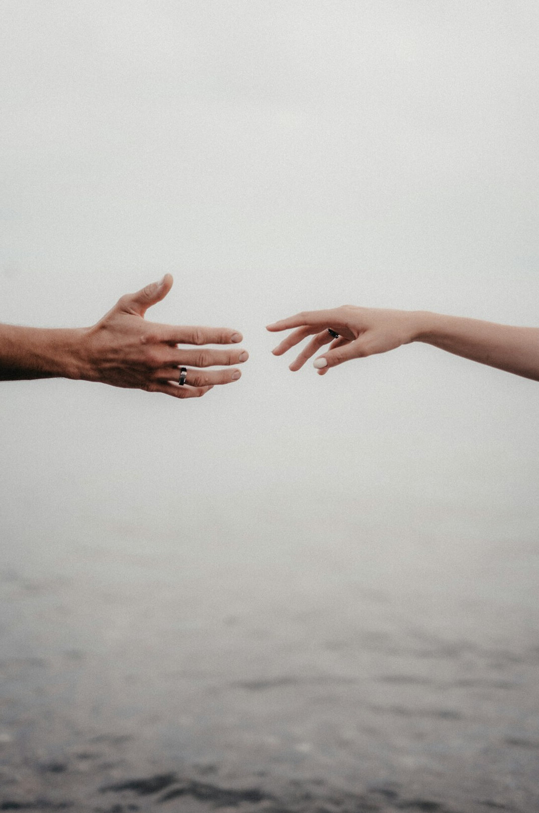 Close-up of hands exchanging a handshake in agreement