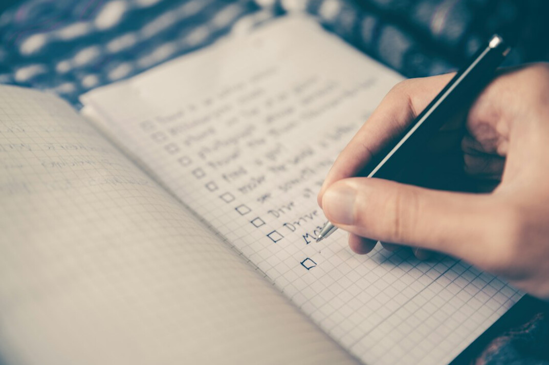person setting goals on paper