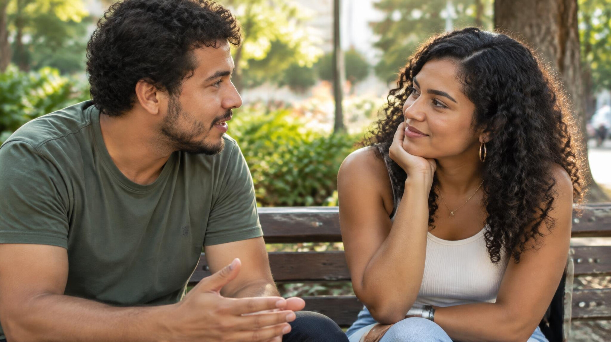 Two people having an open and attentive conversation outdoors