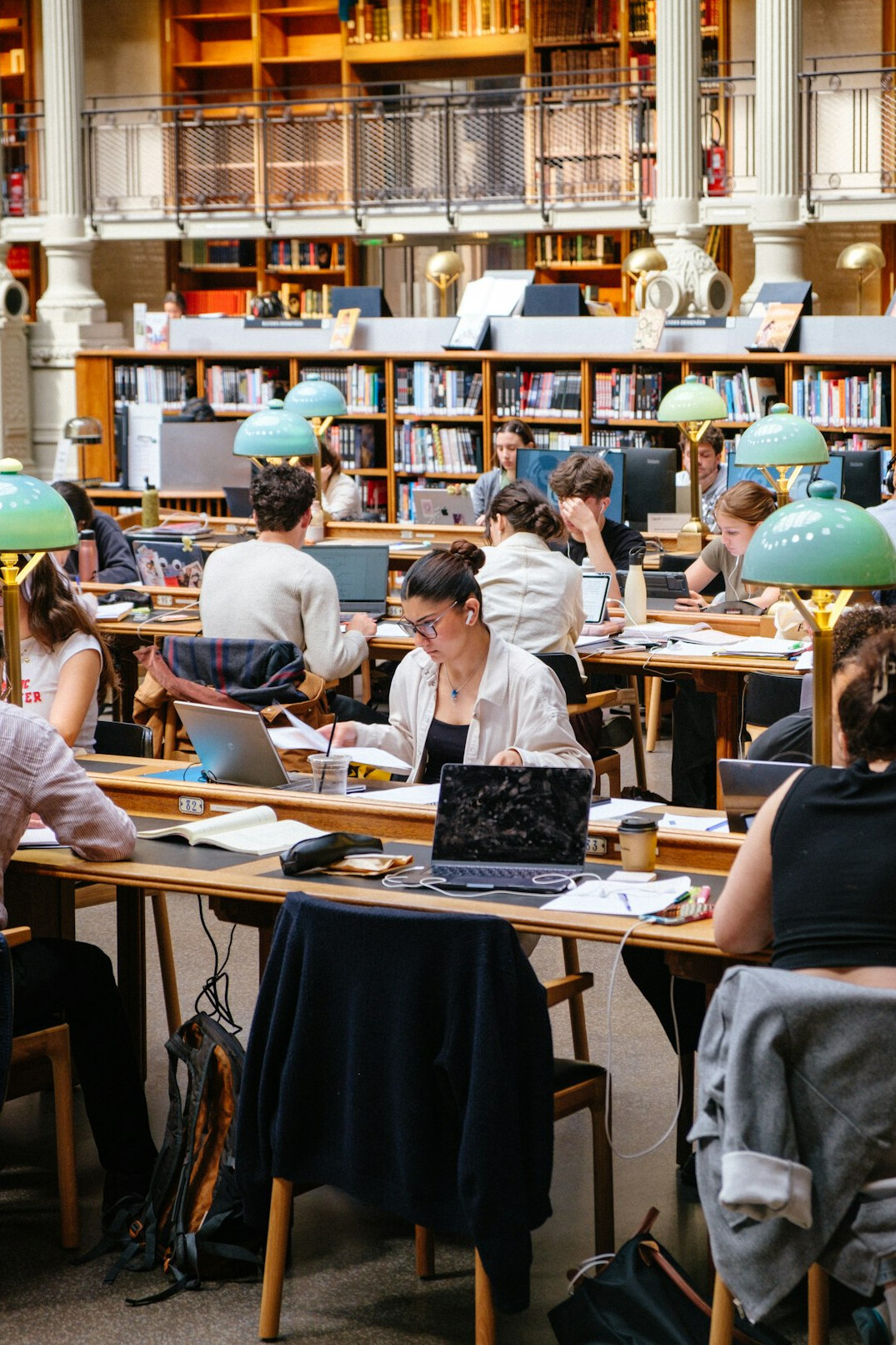person reading book at desk