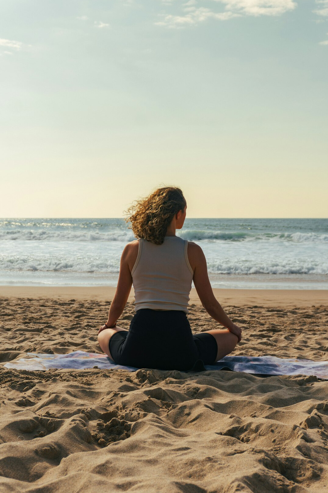 person meditating in nature