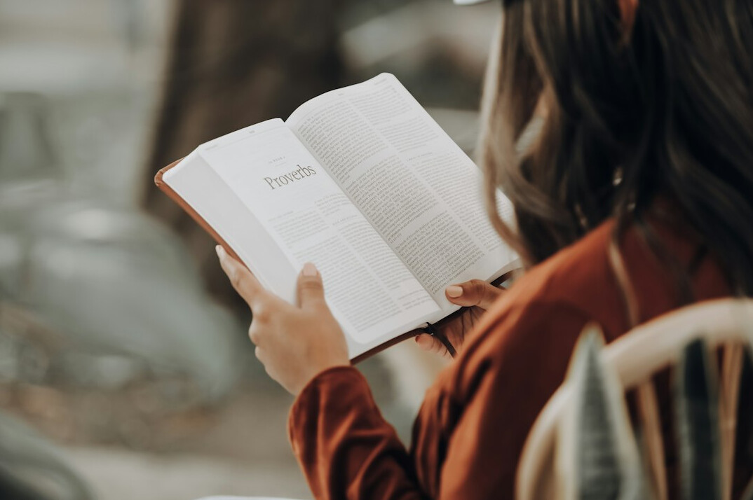 person reading book quietly
